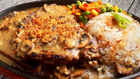 Sizzling Porkchop in Mushroom Gravy .